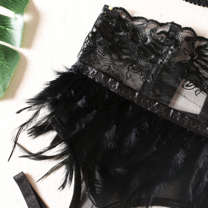Label Lust Indulge in opulence with the Seductive Cage Bra, 3-Piece Lingerie Set | Feathered Black Swan. This luxurious ensemble, featuring a feathered garter belt and thigh straps, is a symphony of allure and elegance. Elevate your intimate moments with this designer lingerie set, perfect for those who seek the epitome of sophistication.